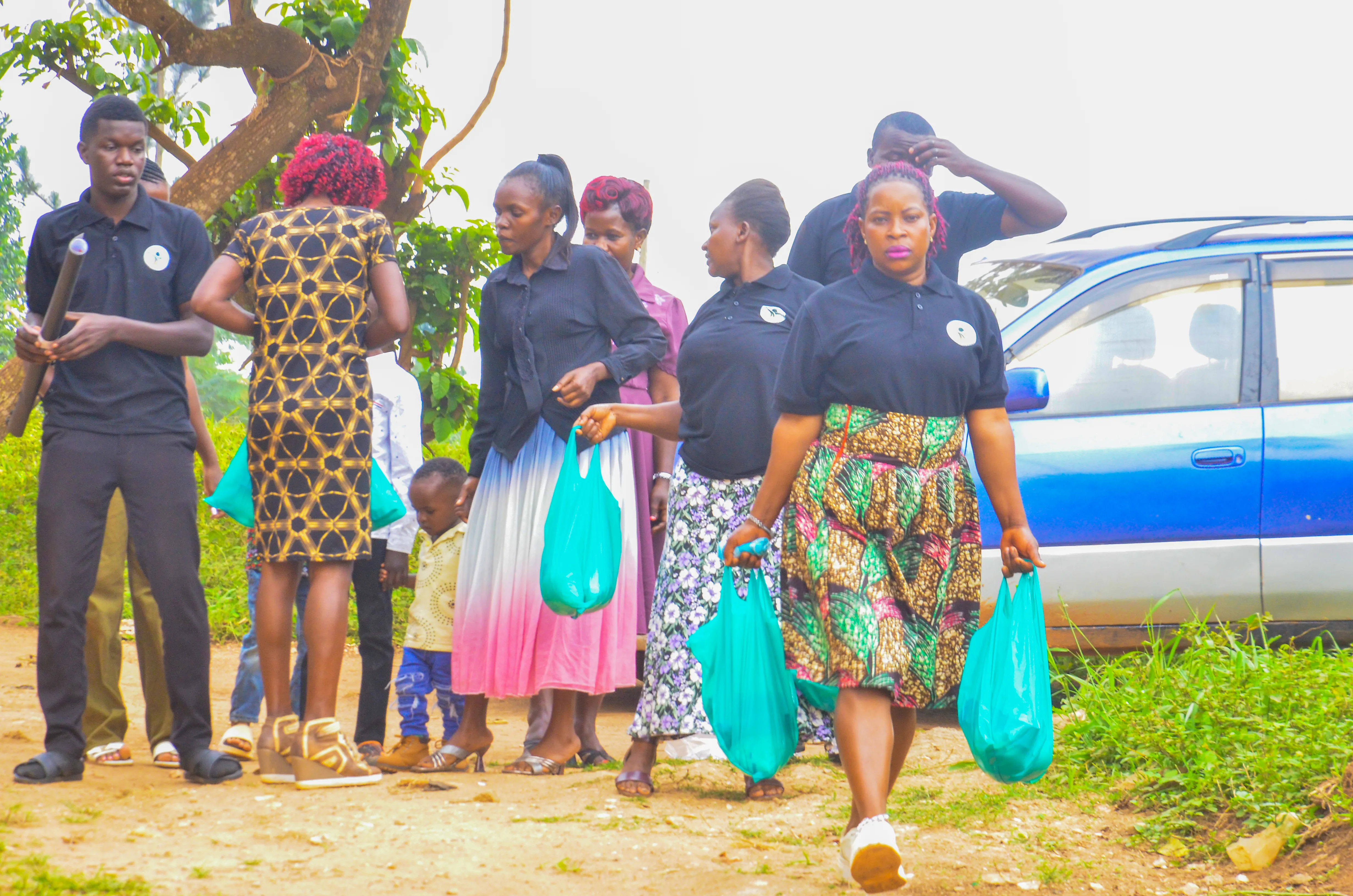Outreach team walking with care packages